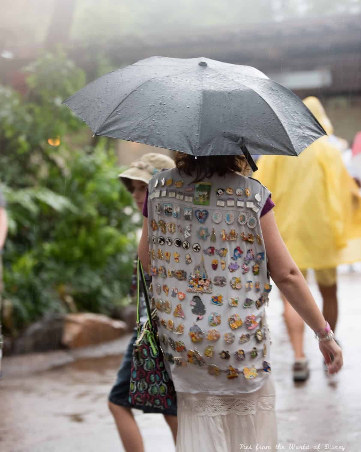 Using travel umbrella in rain at Disney World