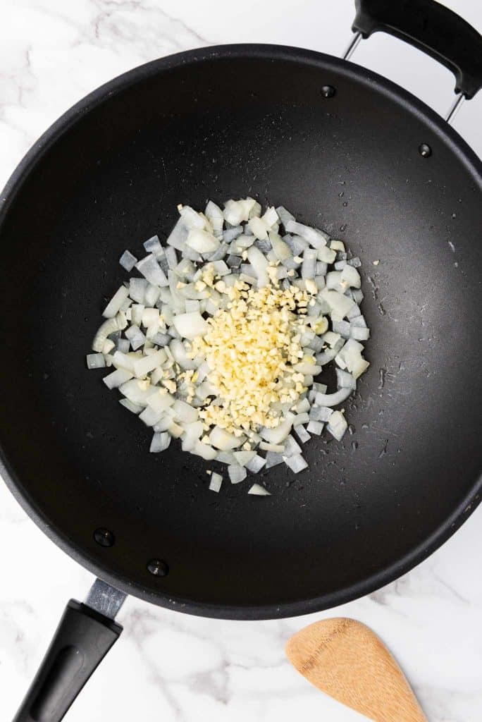 Dice onion and garlic in a pan.