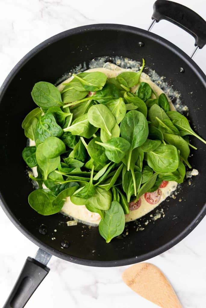 Spinach leaves in a pan.