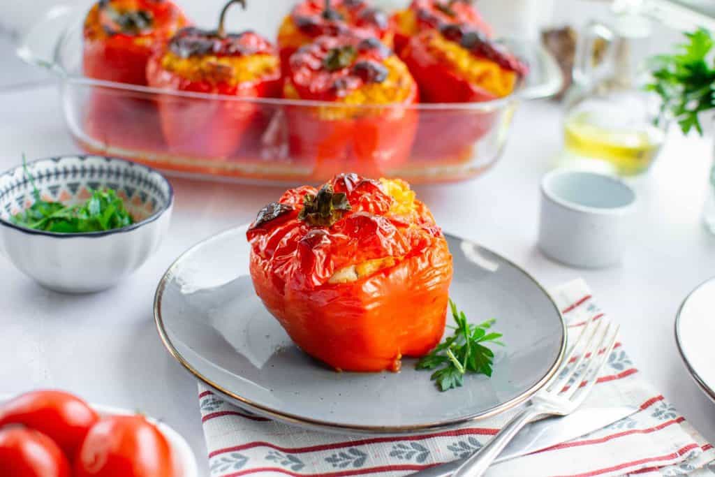 A stuffed pepper in a plate.