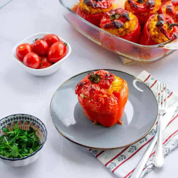 A stuffed pepper in a plate.