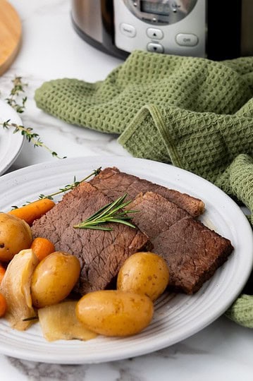 Rump roast served with vegetables.