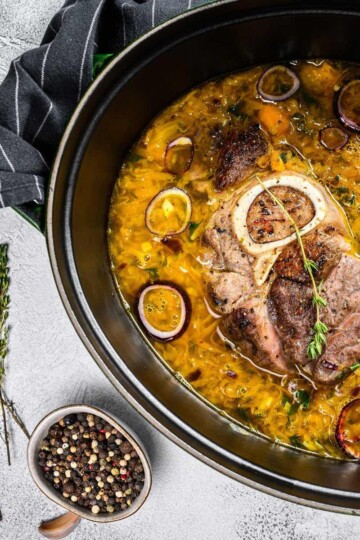 Ossobuco meat in a cast iron pan.