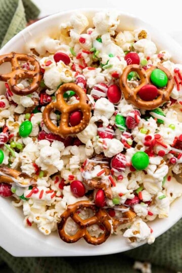 Christmas popcorn in a white bowl.