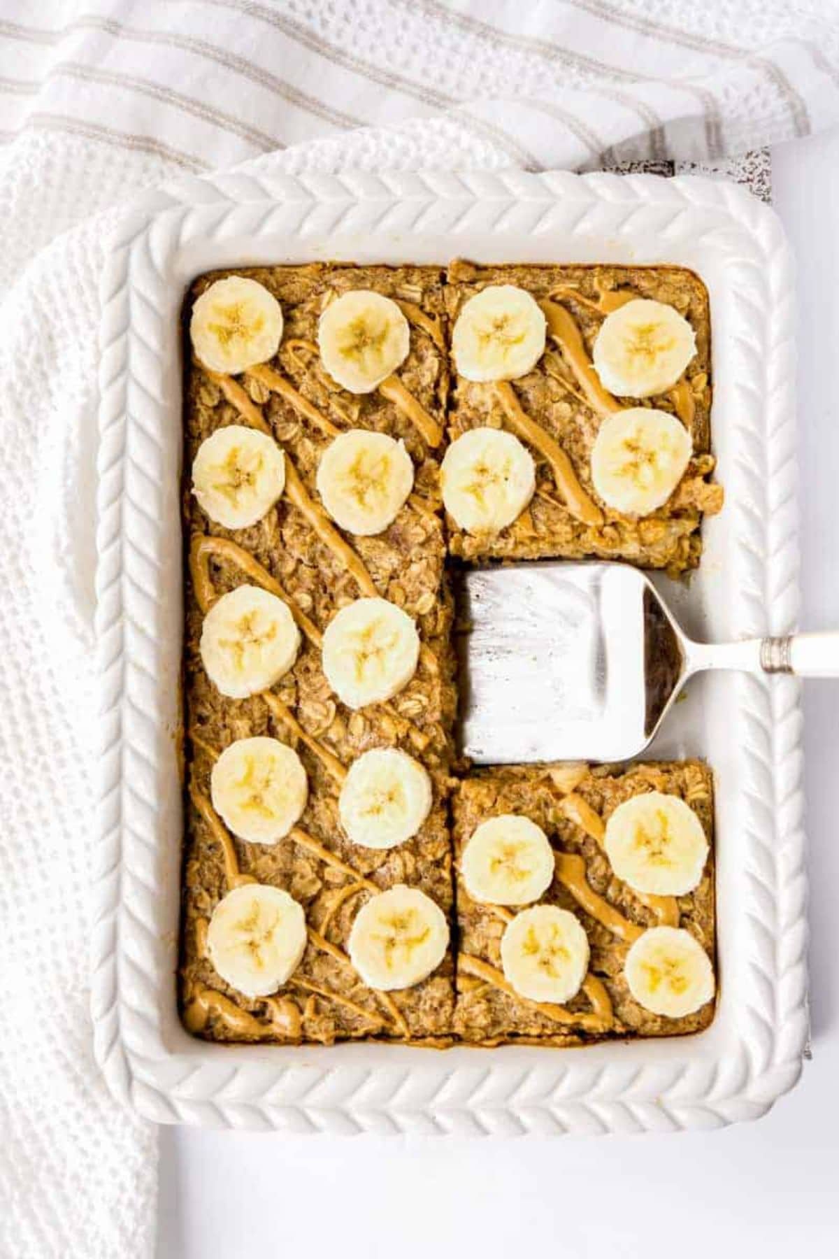 Served peanut butter banana baked oatmeal on a baking dish.