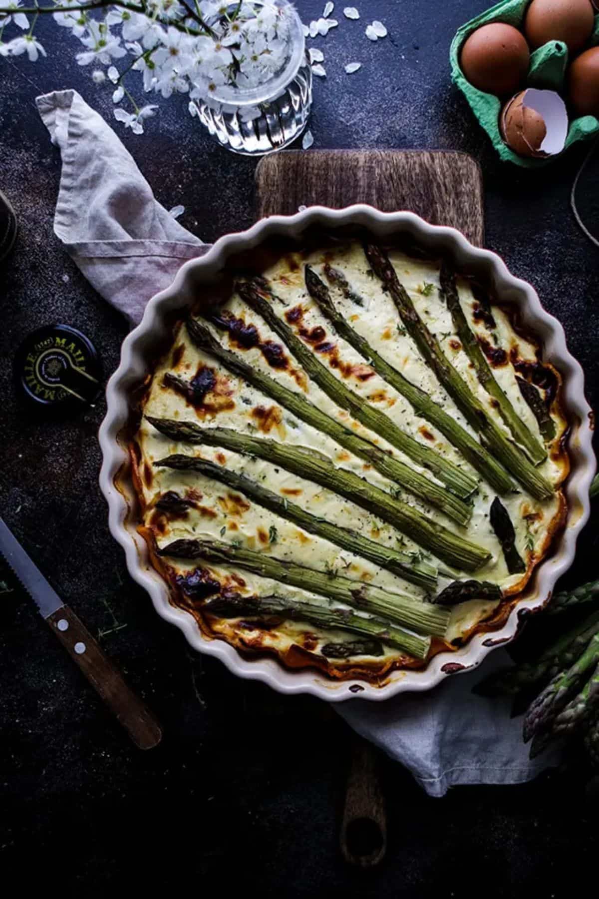Decorated asparagus quiche with sweet potato crust.