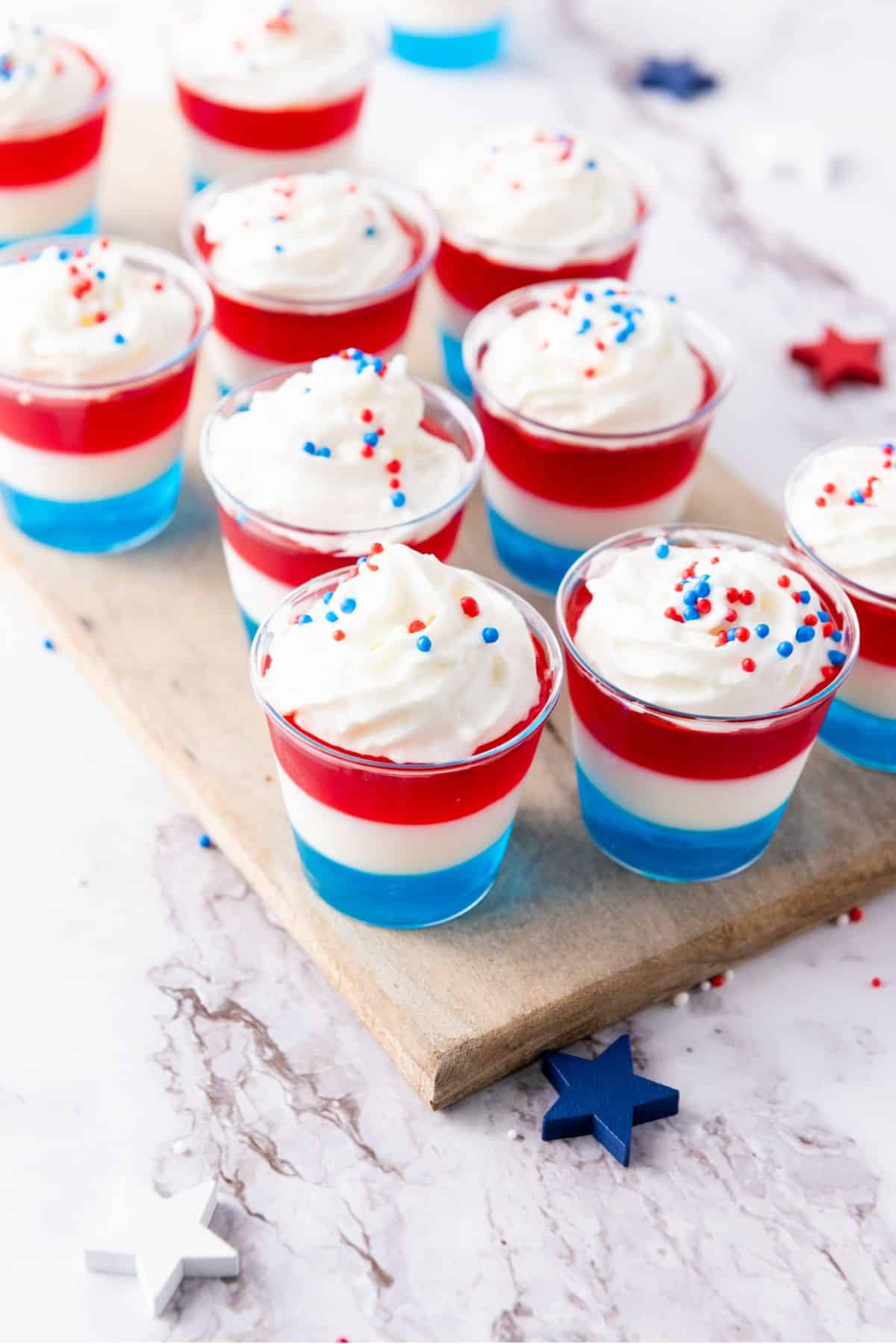 Layered Jell-O shots in small glasses.