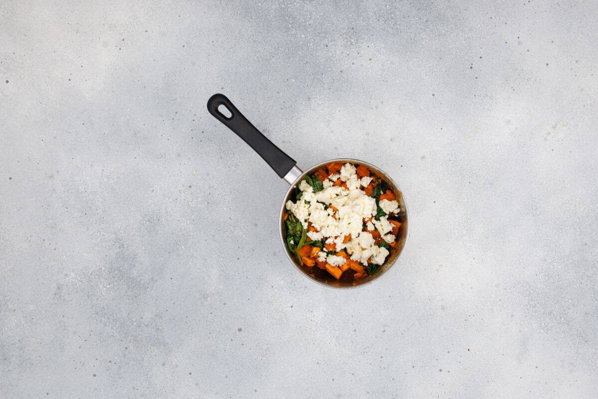 Ingredients being mixed together in a saucepan.