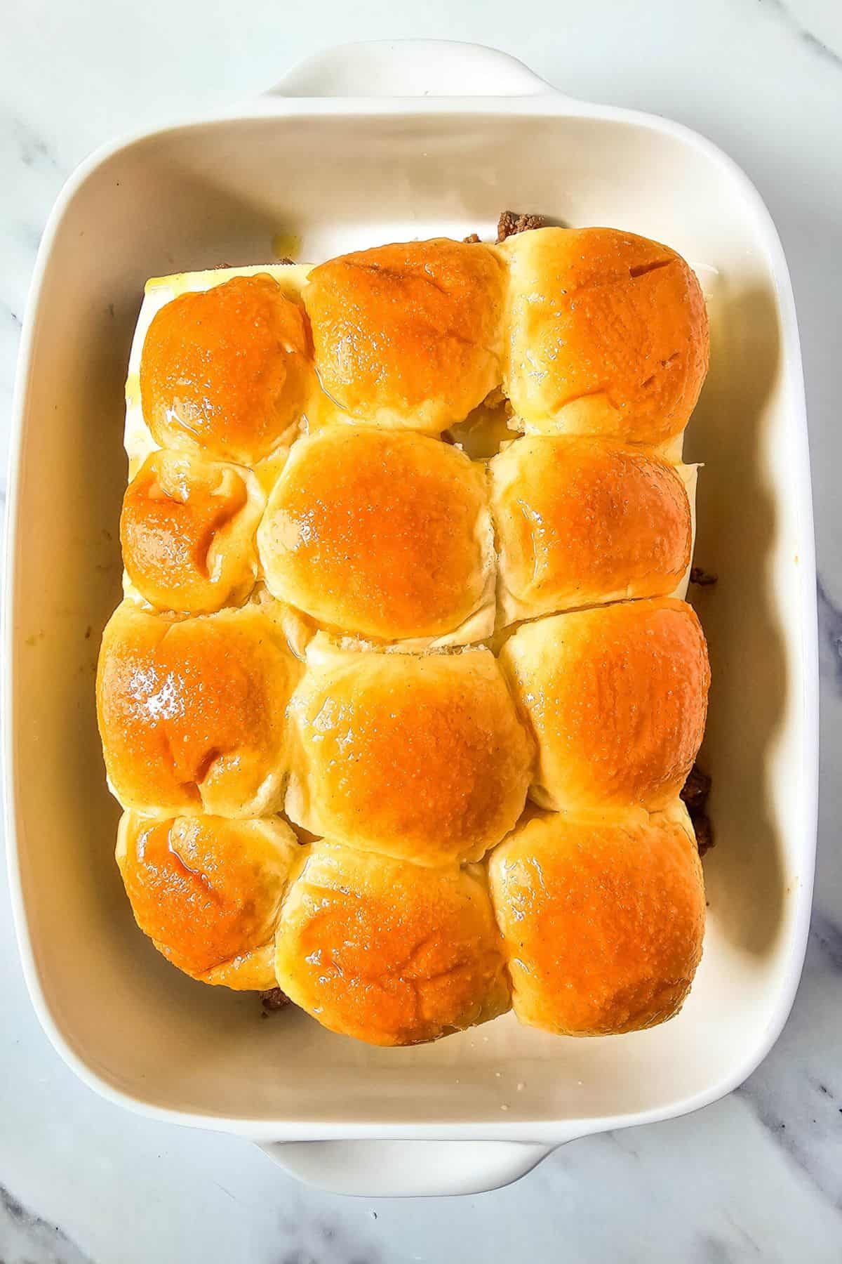 A serving dish with sliders.