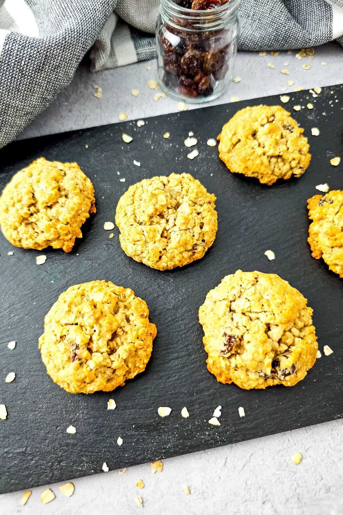 Oatmeal raisin cookies lined up neatly on a serving tray.