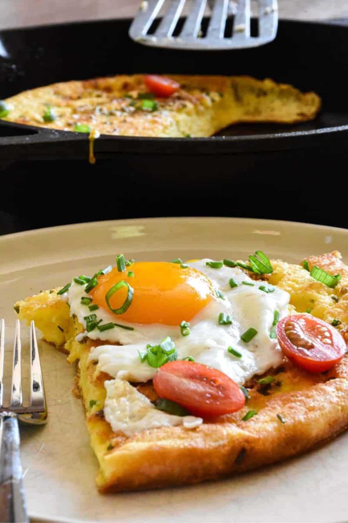 Close-up photo of sourdough dutch pancake topped with sunny side up egg.
