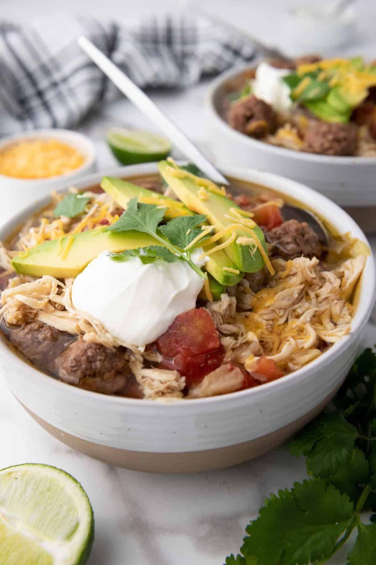 A bowl of taco soup with visible beans, meat, and vegetables.
