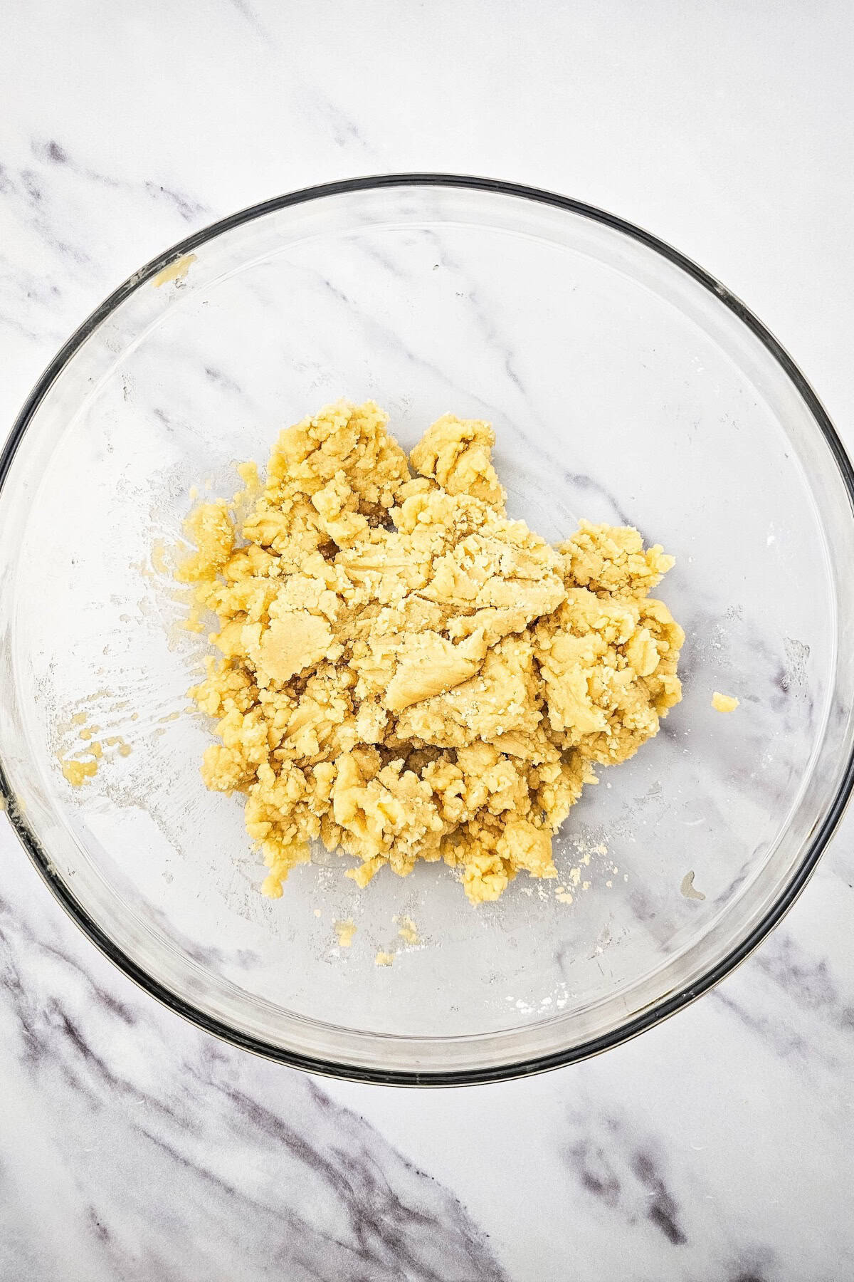 Batter mixture in a bowl, partially blended and ready for the next step.