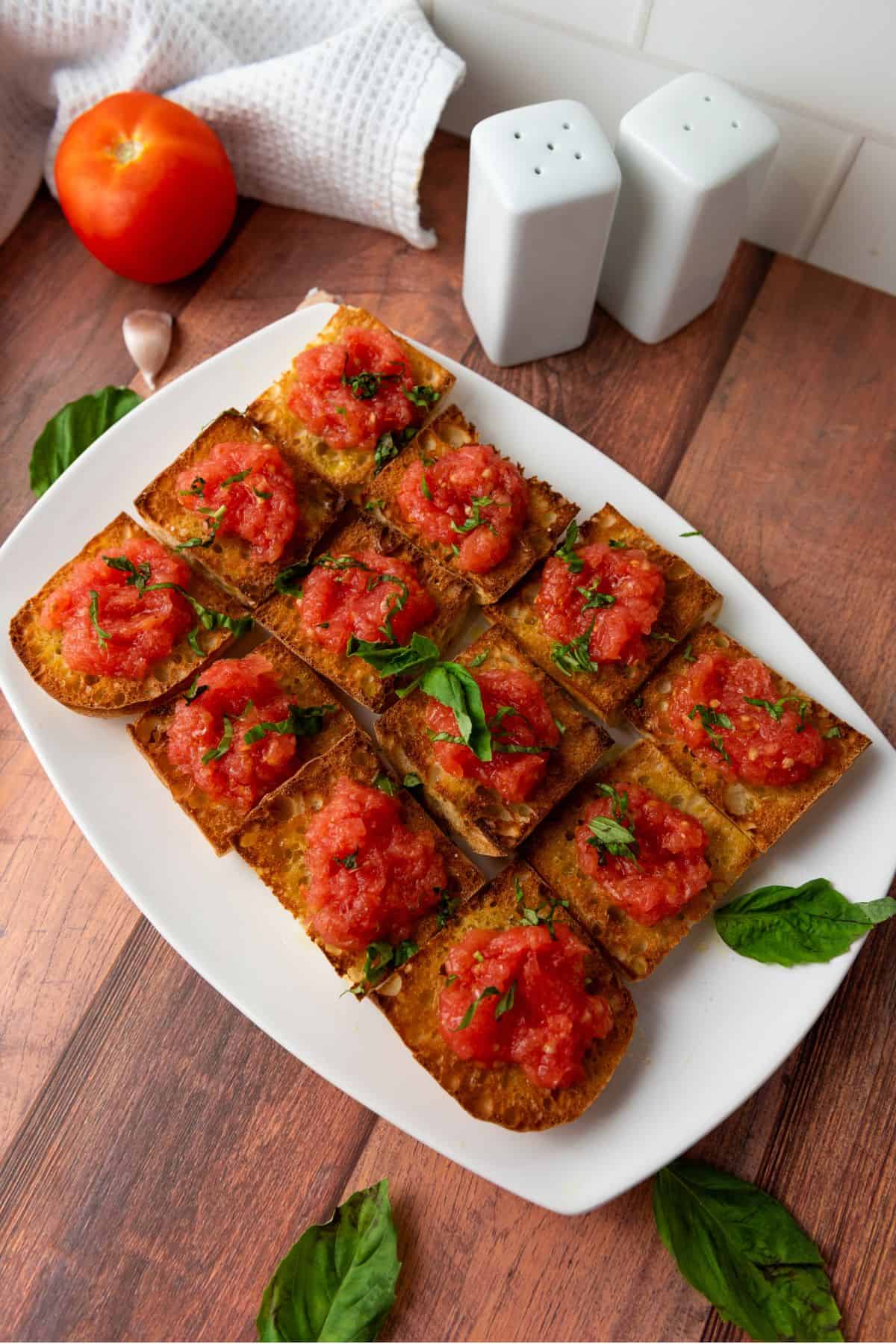 A plate with Spanish Pan con Tomate tapas made with five simple ingredients.