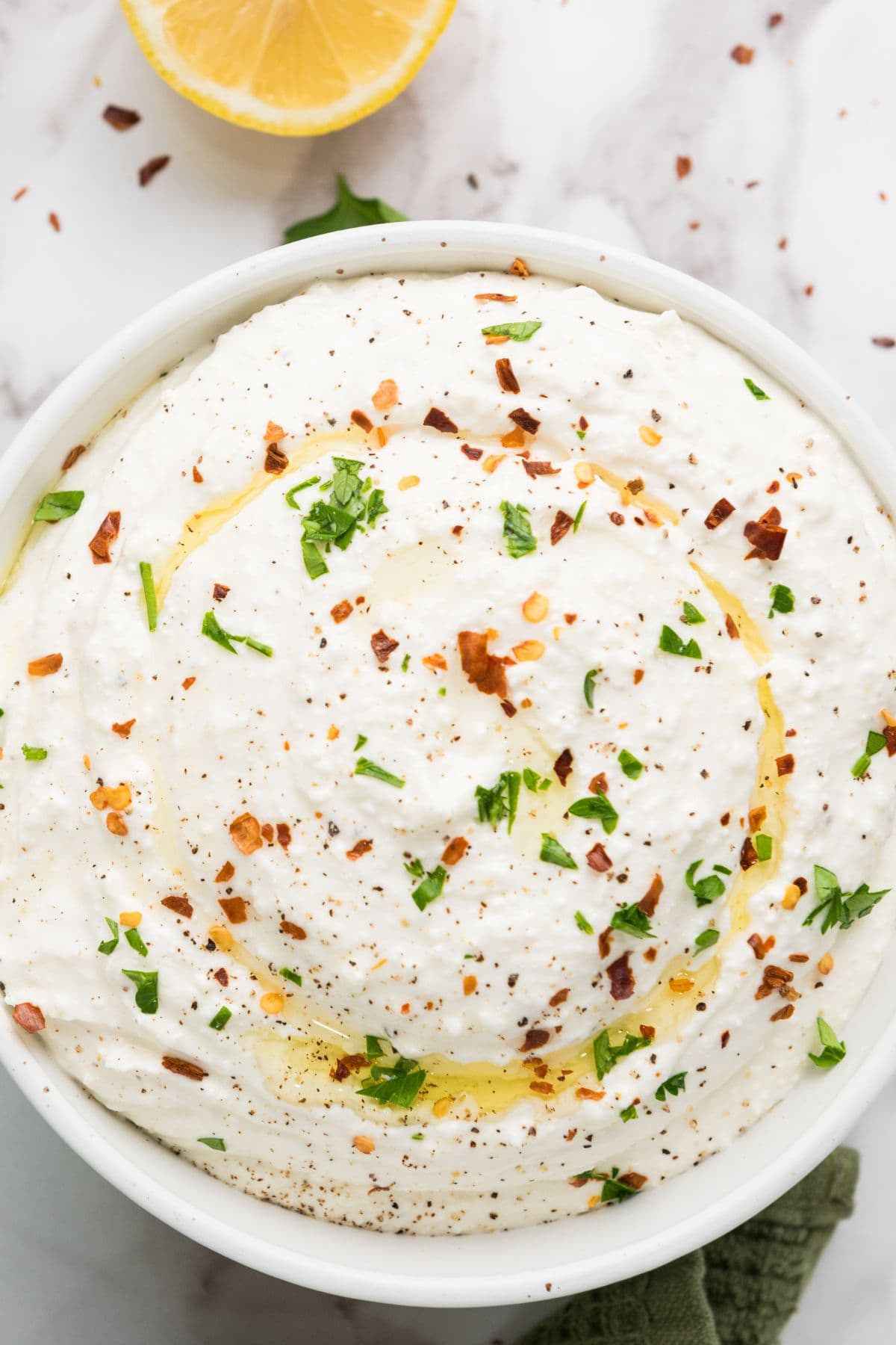 Close-up photo of whipped feta dip served in a bowl.