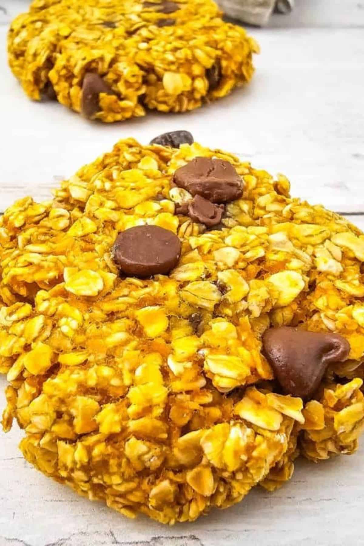 Oatmeal Pumpkin Cookies arranged on a surface, showing the chewy texture and pumpkin-spiced ingredients.