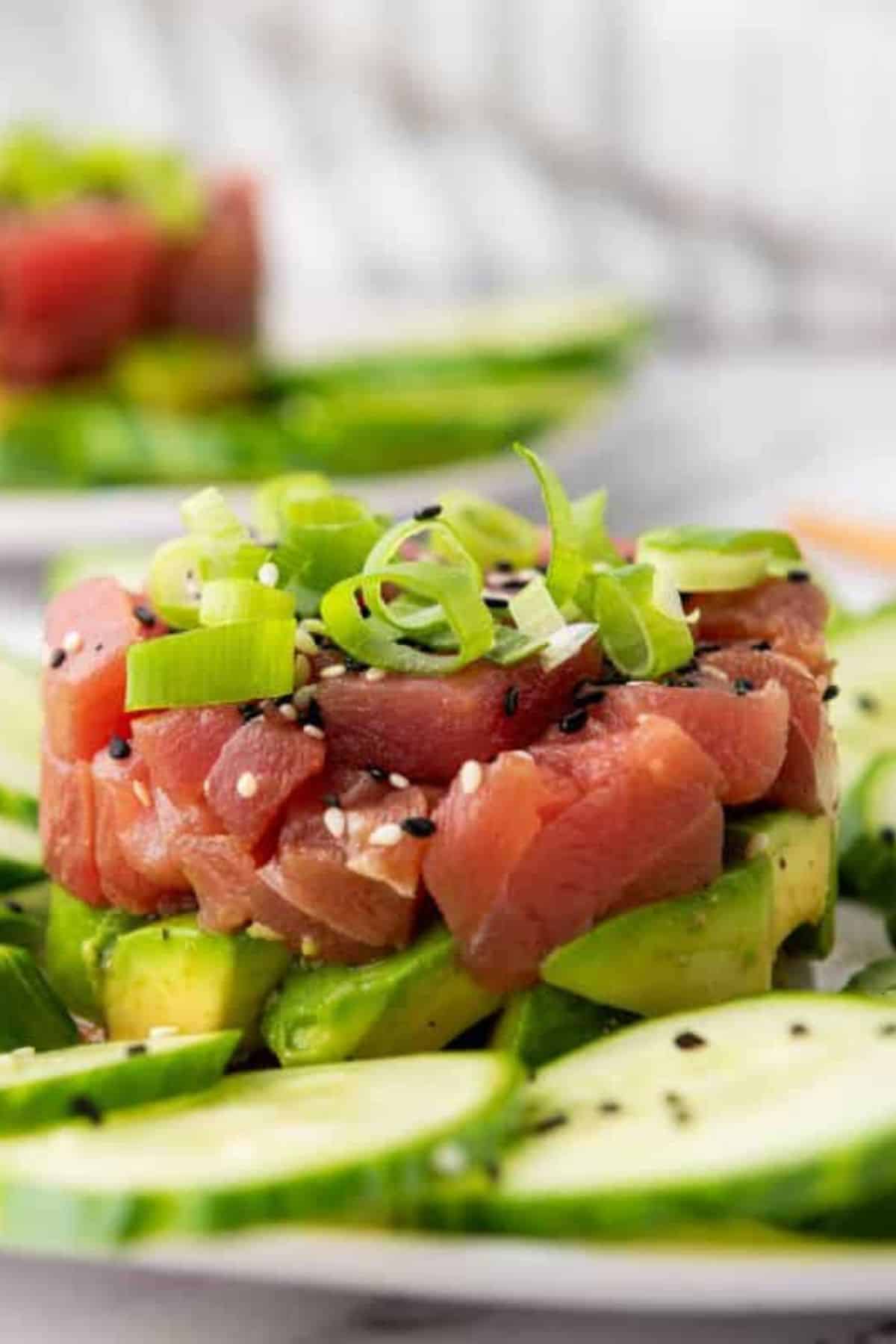 Close-up of tuna tartare salad showing diced tuna mixed with seasonings.