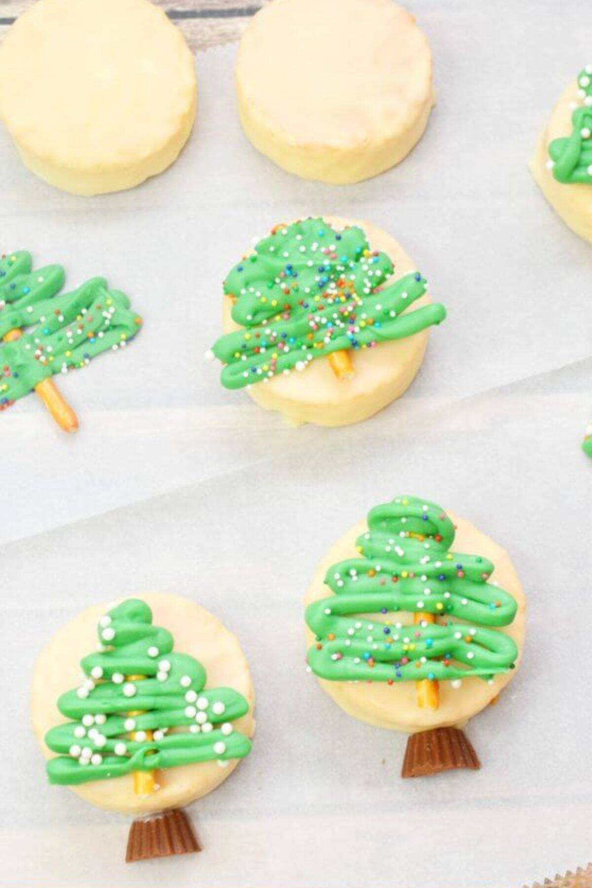 Snow globe–shaped treats arranged on parchment paper.