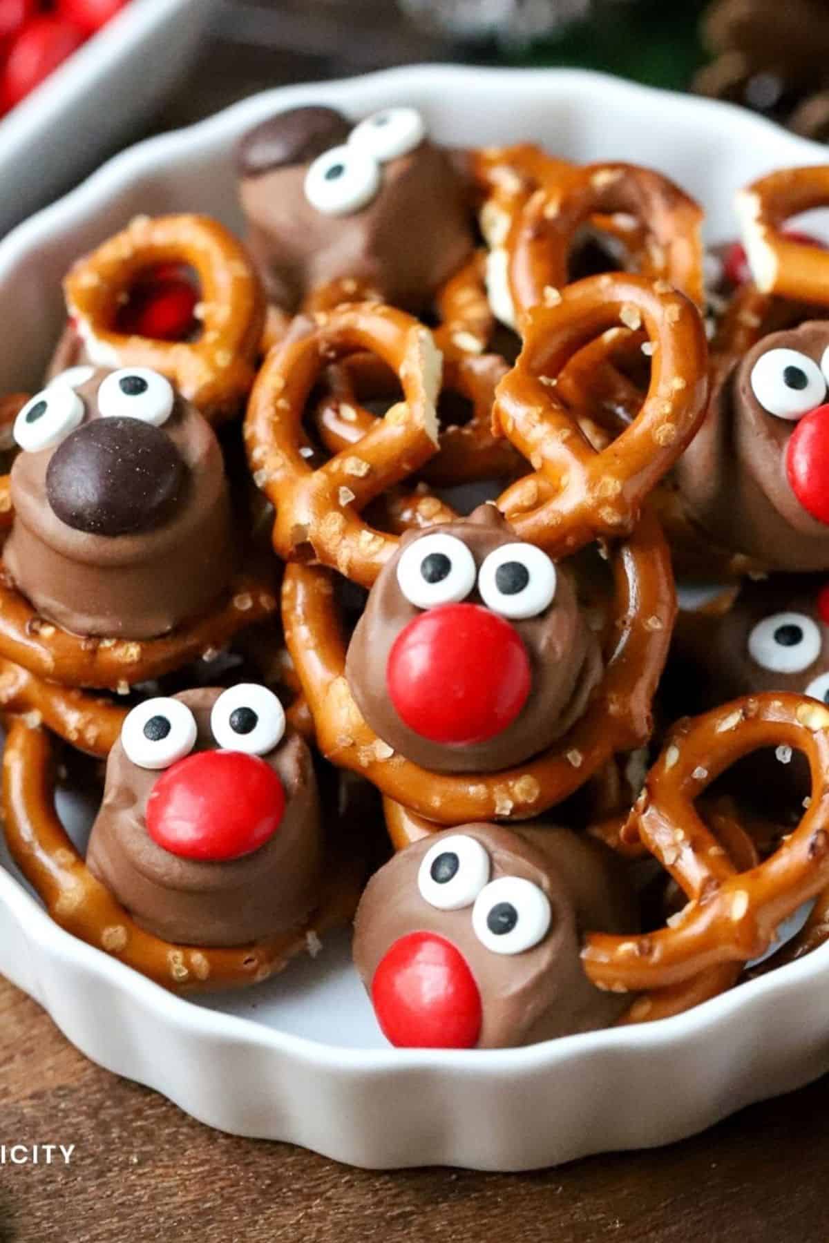 Rolo Pretzel Reindeer stacked on a plate, showing chocolate, caramel centers, and pretzel antlers.