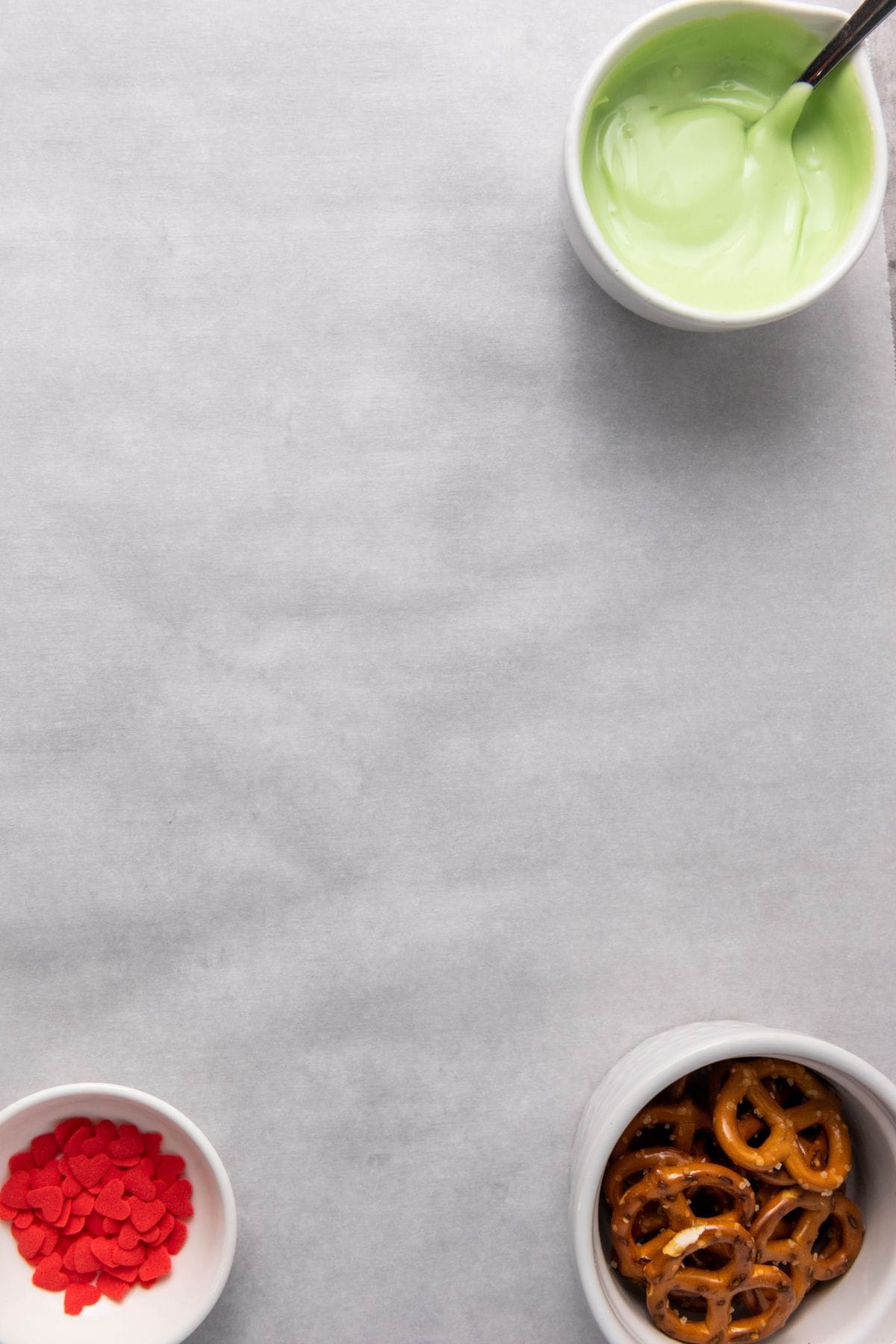 Christmas pretzel ingredients placed on a surface.