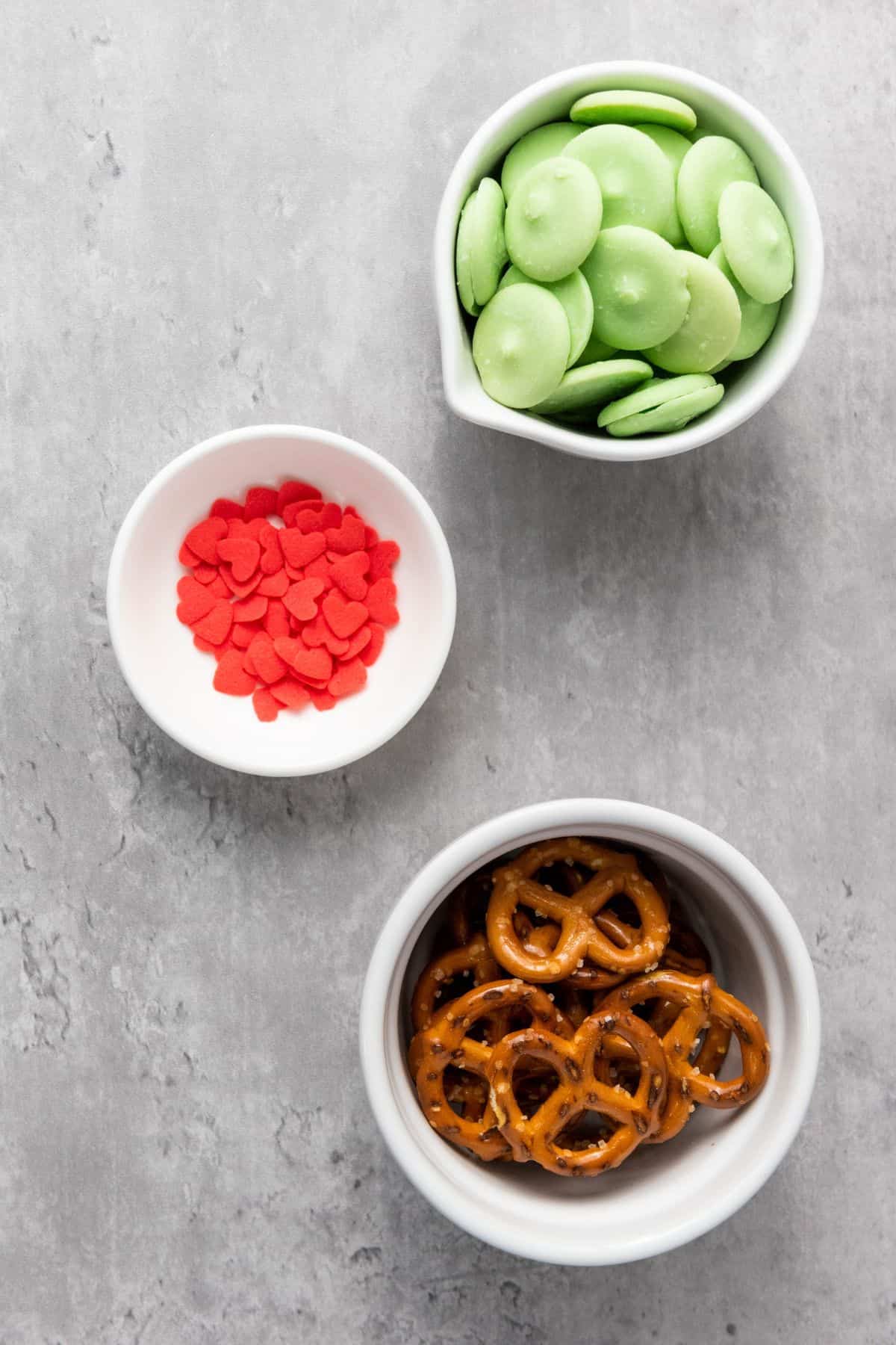 Ingredients for Christmas pretzels arranged on a surface.