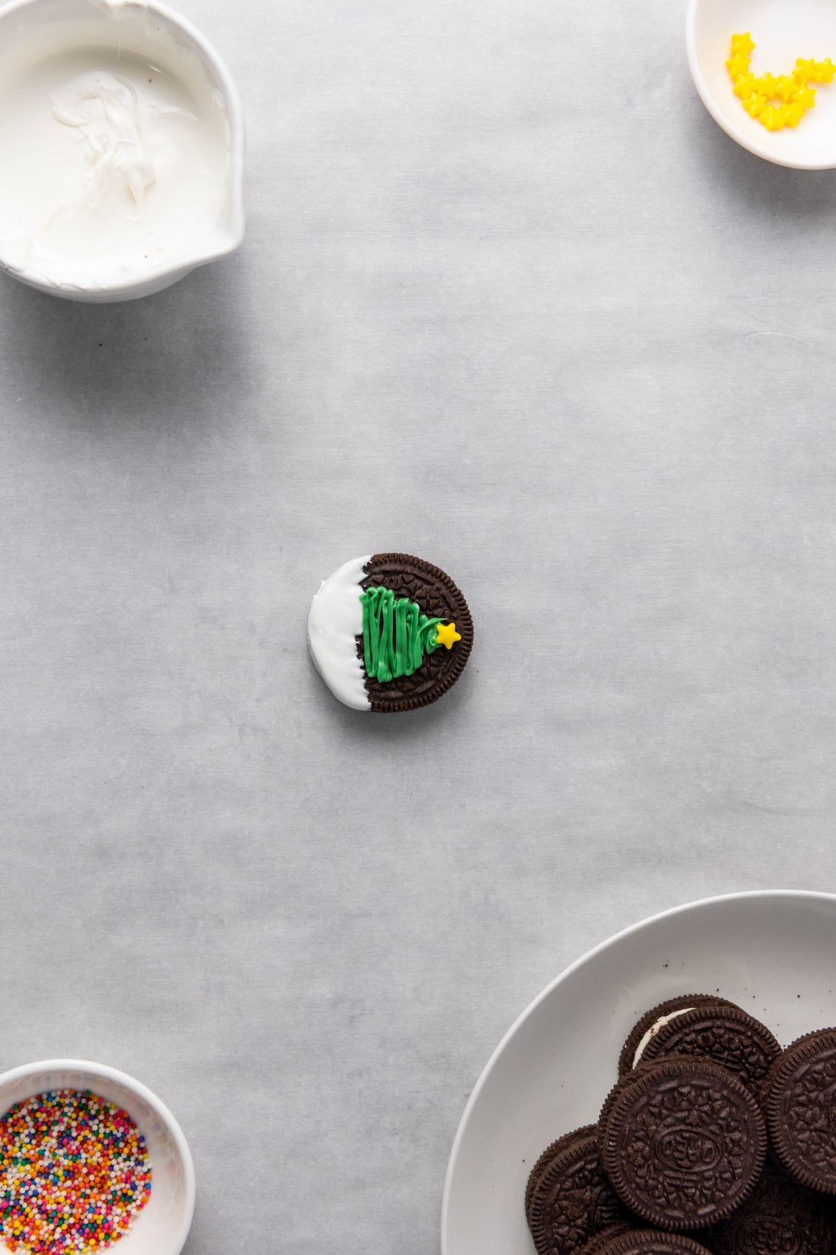 Single Oreo decorated like a Christmas tree.