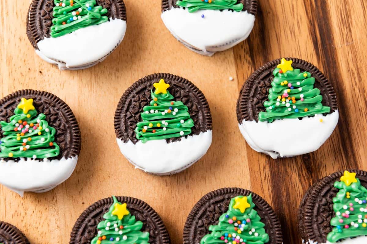 Christmas tree Oreo cookies on a wooden board.