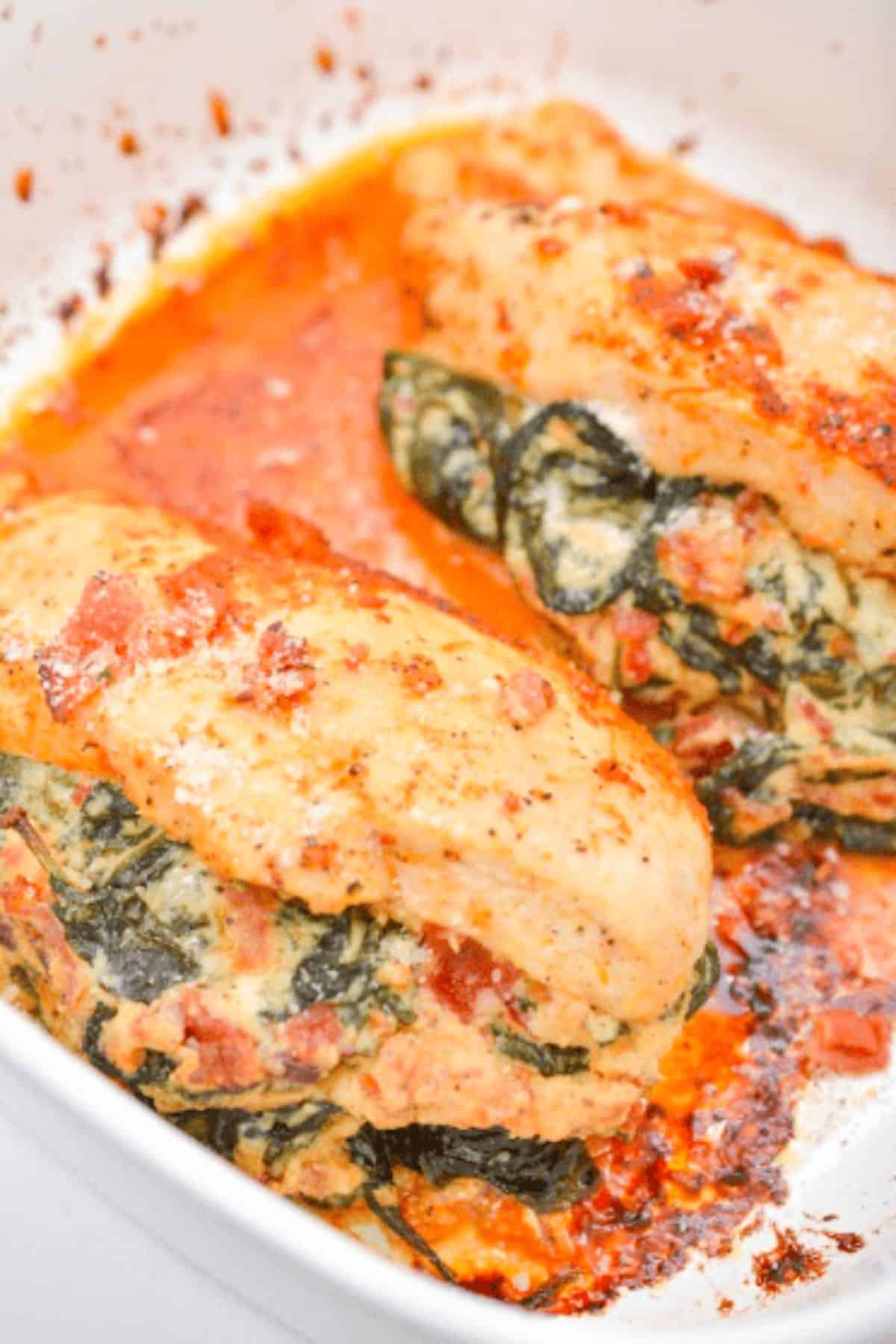Creamed Spinach Stuffed Chicken baked until golden, then served in a creamy garlic sauce that keeps the chicken tender and juicy.