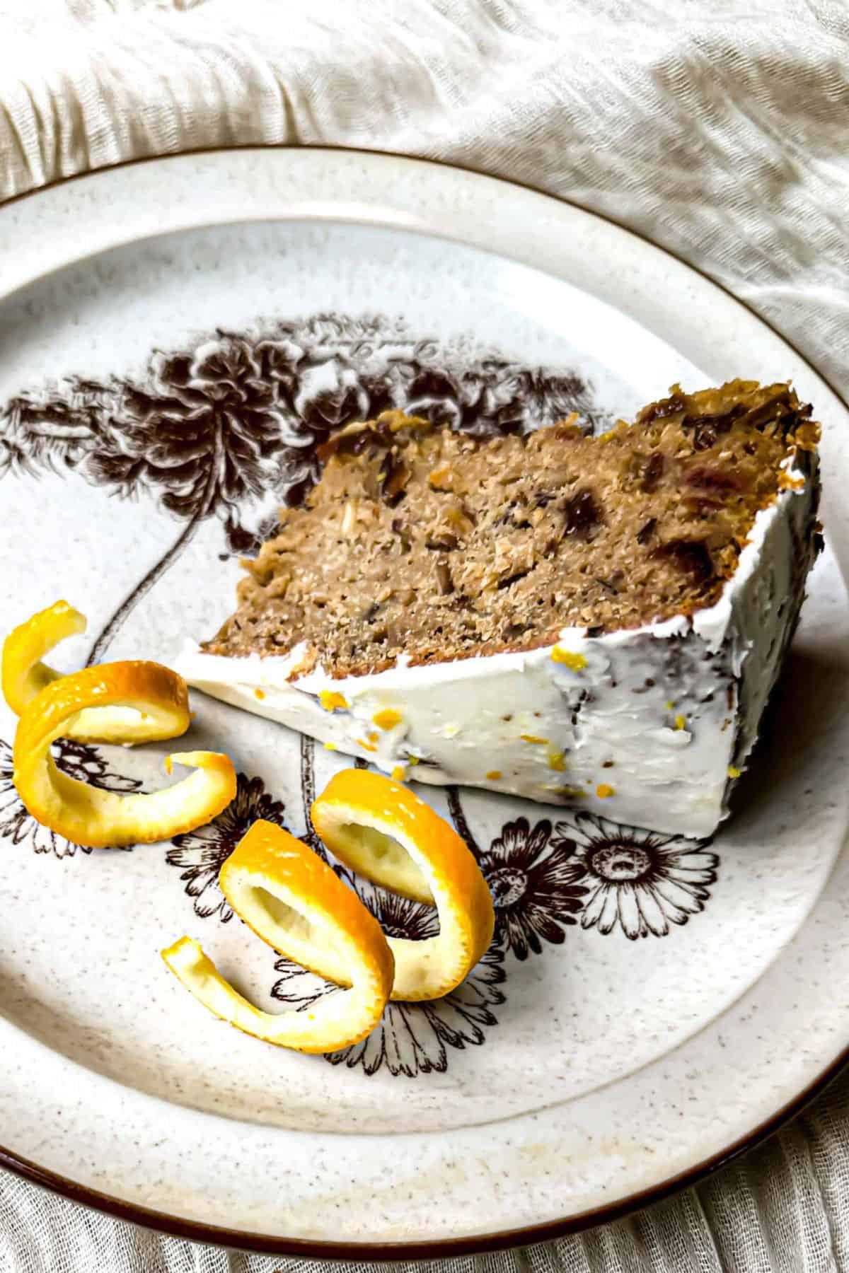 A plate with sourdough Christmas cake with dried fruits, garnished with festive decorations.