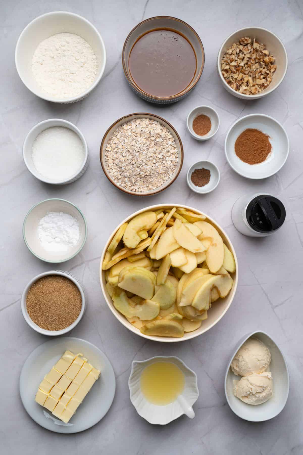 Ingredients for apple crisp laid out on a surface.