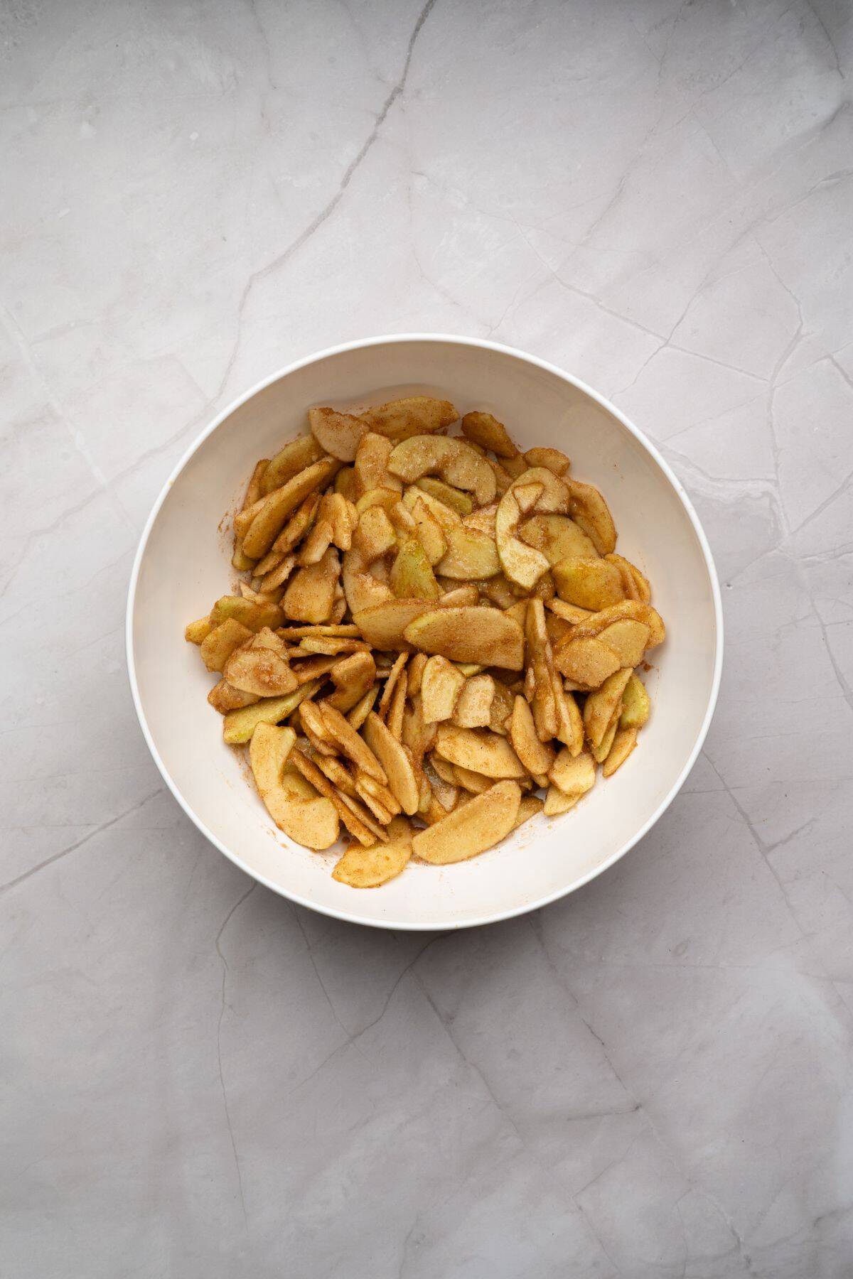 Ingredients being mixed together in a medium bowl.