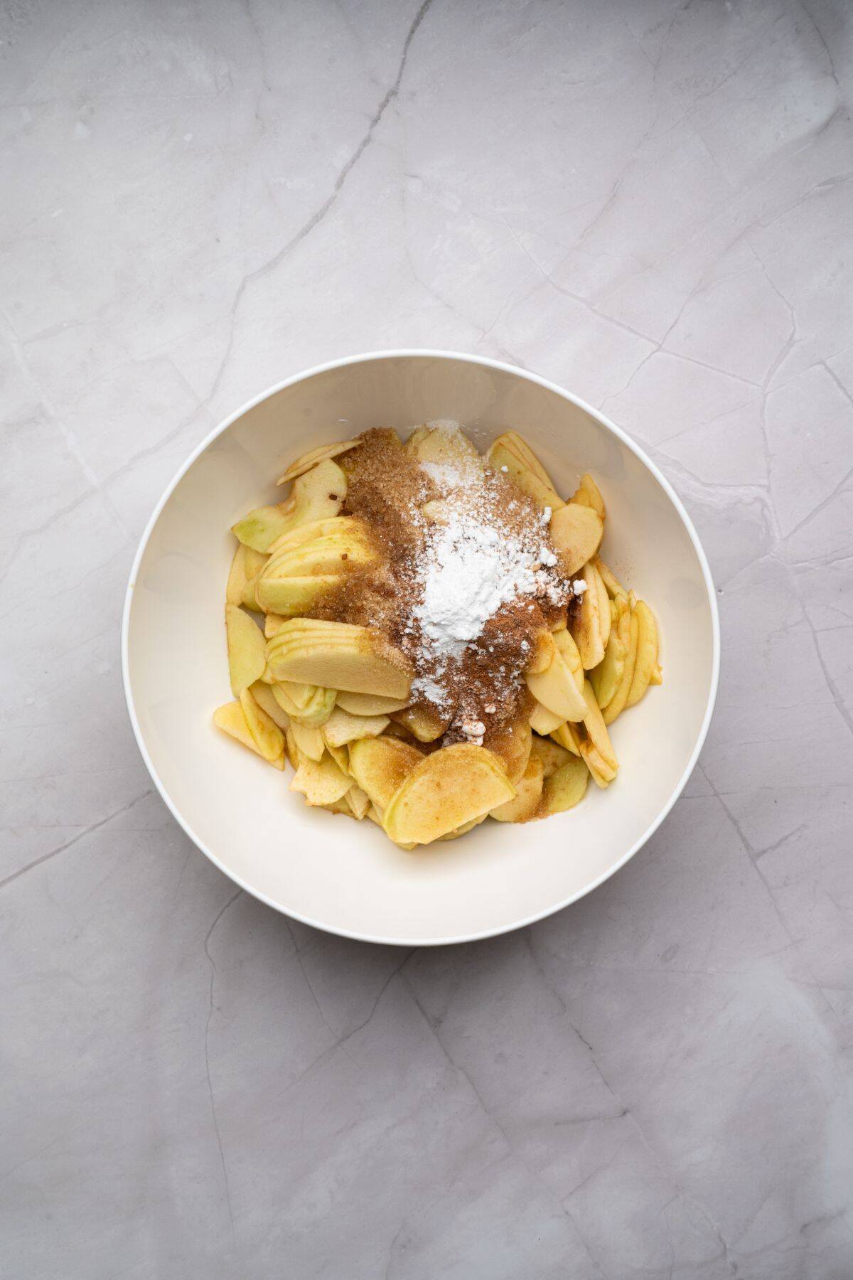 Ingredients being mixed in a medium bowl.