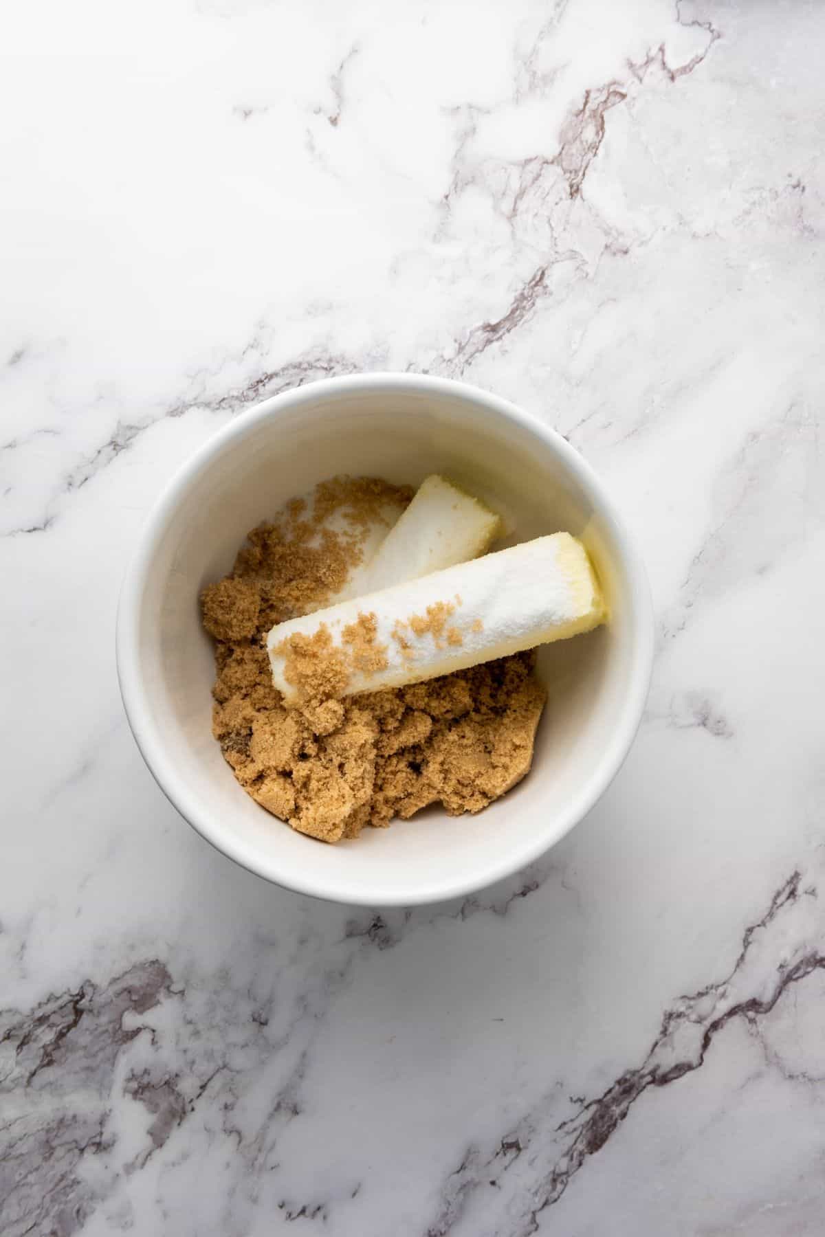A bowl filled with cookie ingredients, ready to be mixed together.