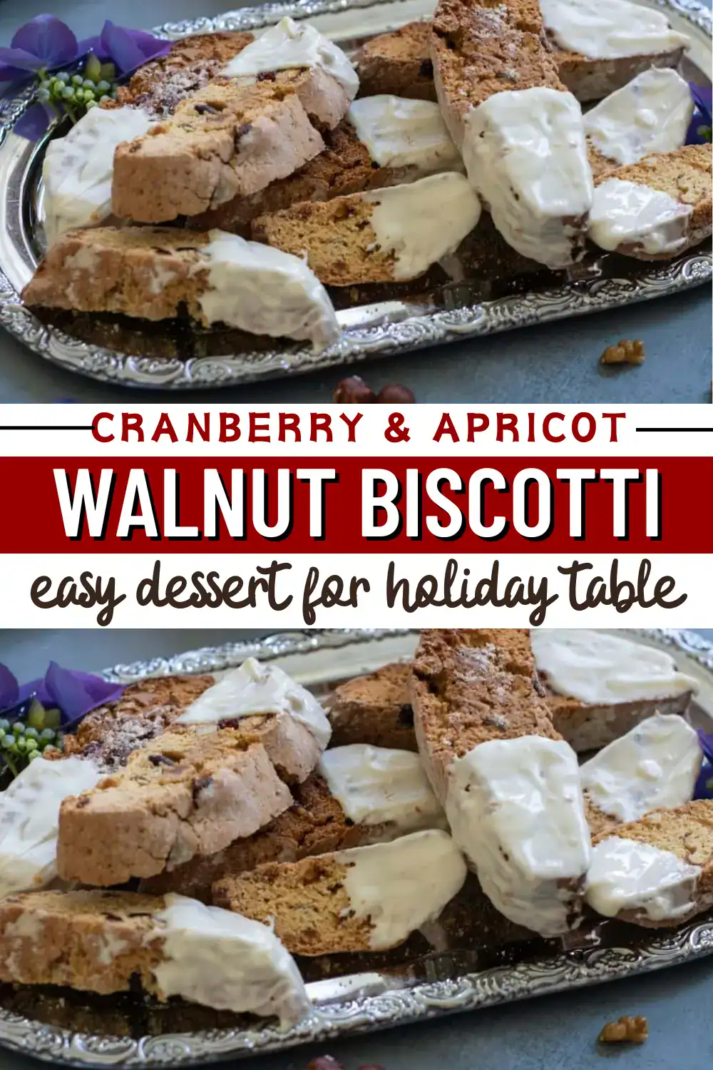 Close-up of cranberry, apricot, and walnut biscotti drizzled with white chocolate on an ornate silver tray.