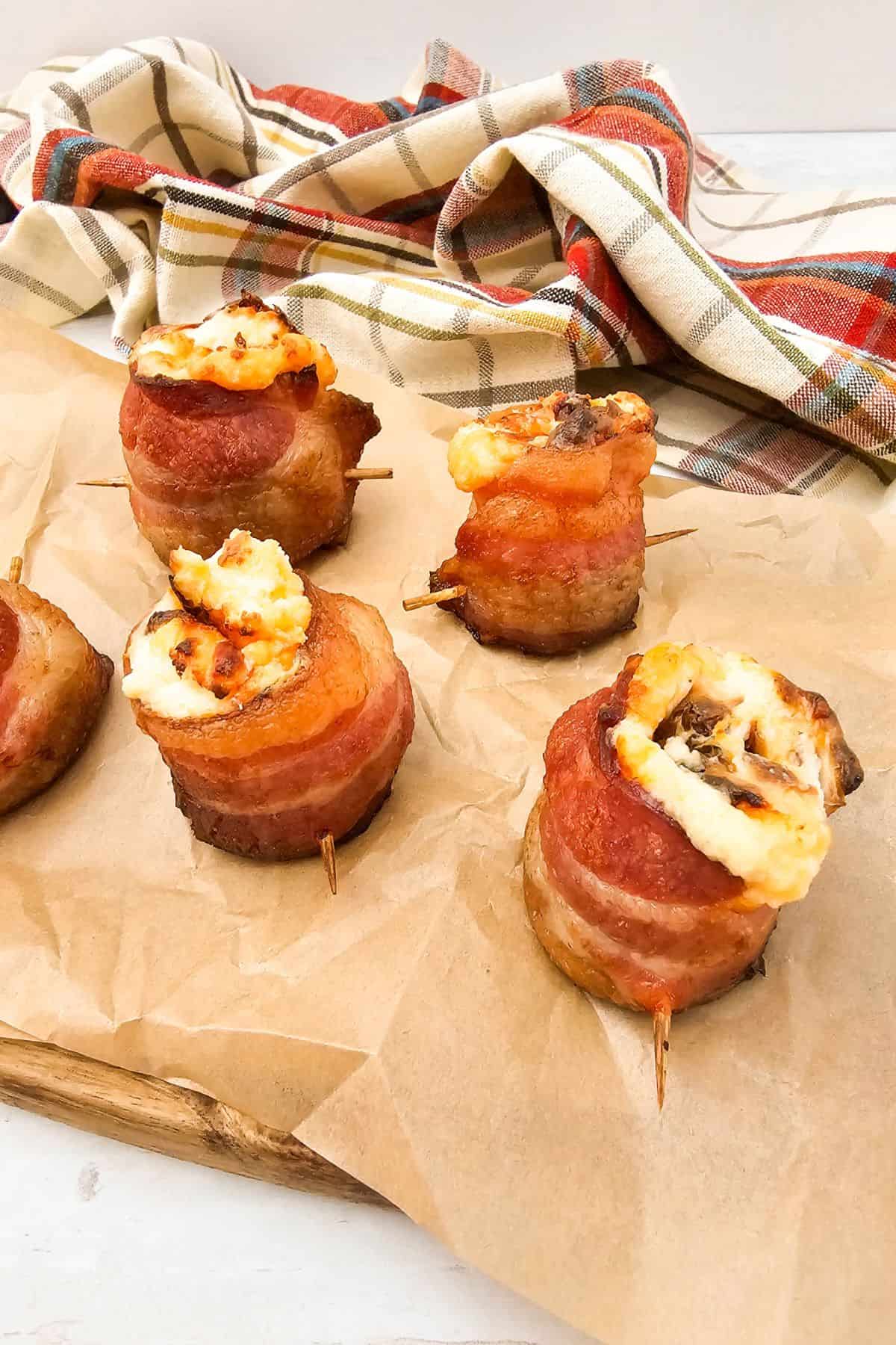 Air fryer pig shots arranged on parchment paper, ready to serve.