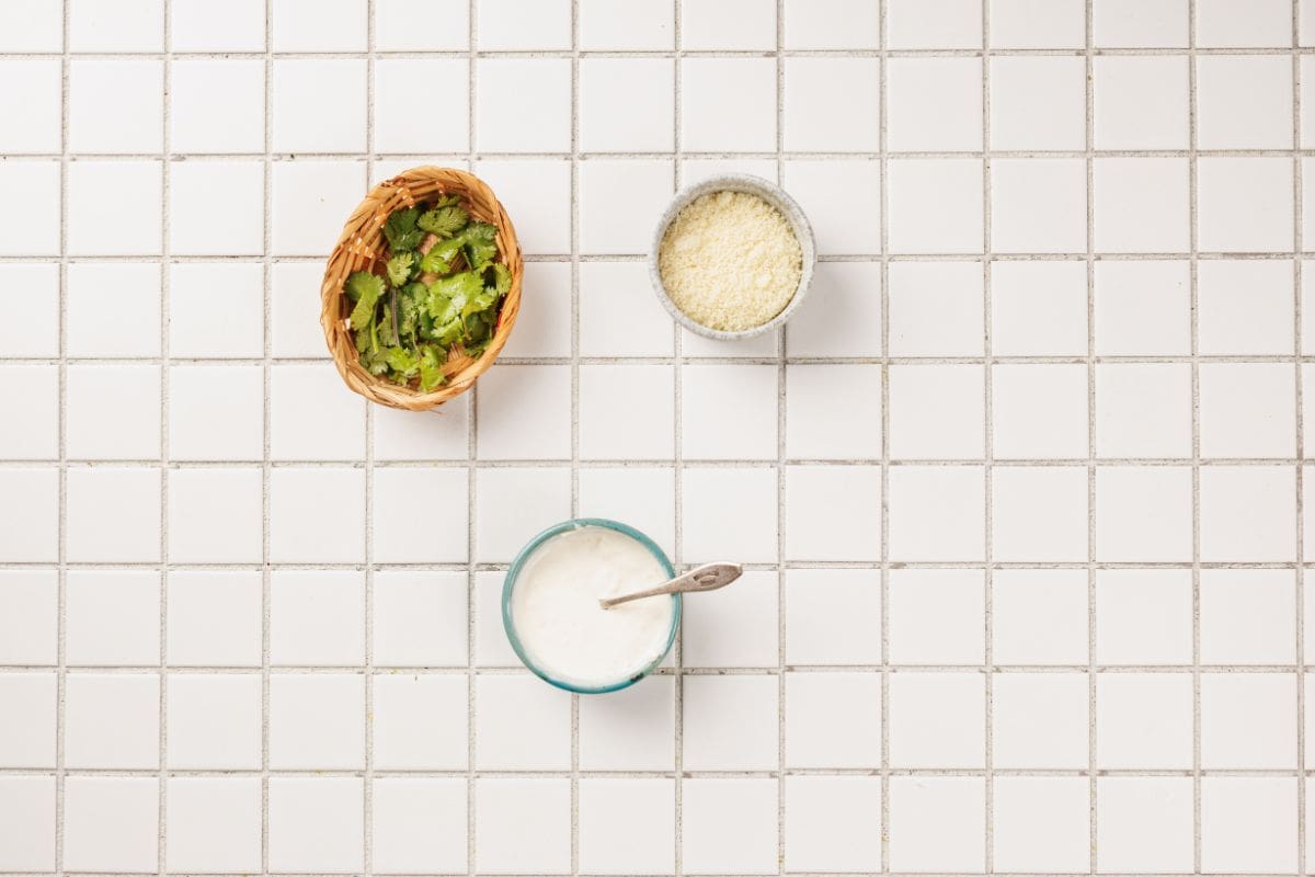 Ingredients for Hasselback potatoes arranged on a tabletop.