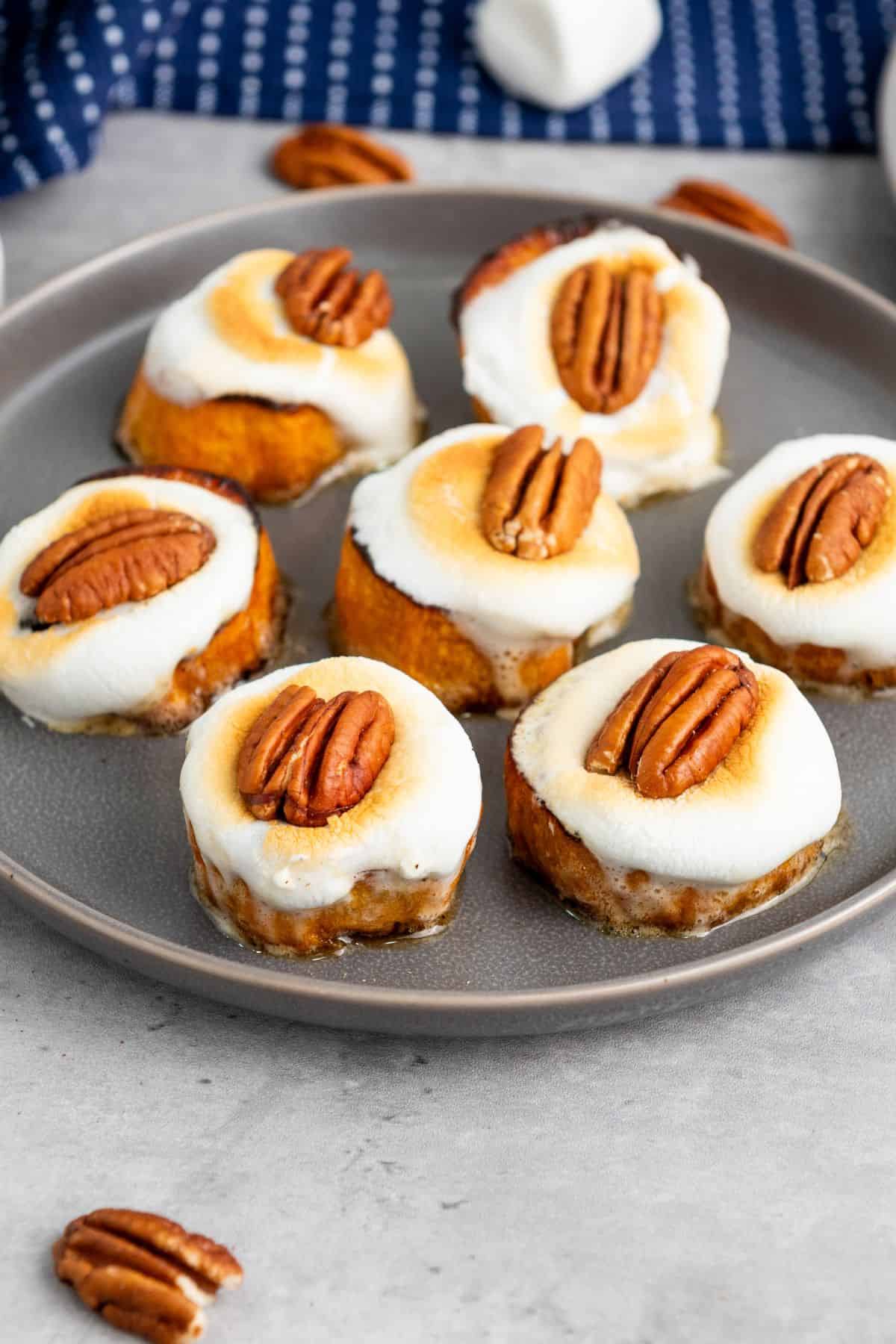 Baked sweet potato bites neatly arranged on a plate.