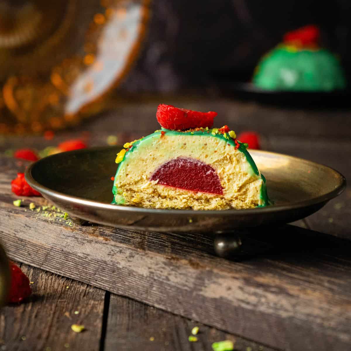 A single plated dessert being sliced open, revealing its layered filling inside.
