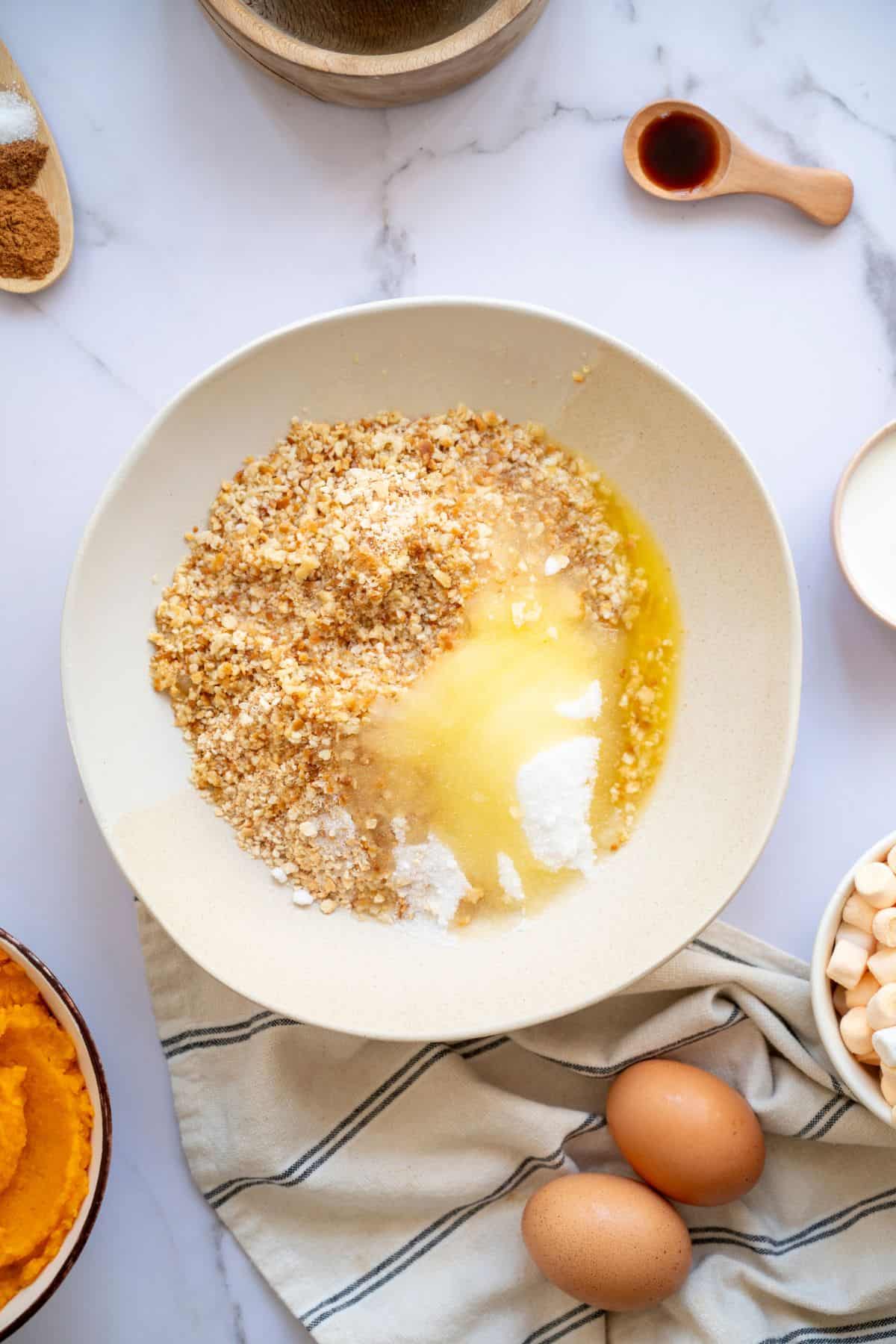 Ingredients being mixed in a medium bowl.