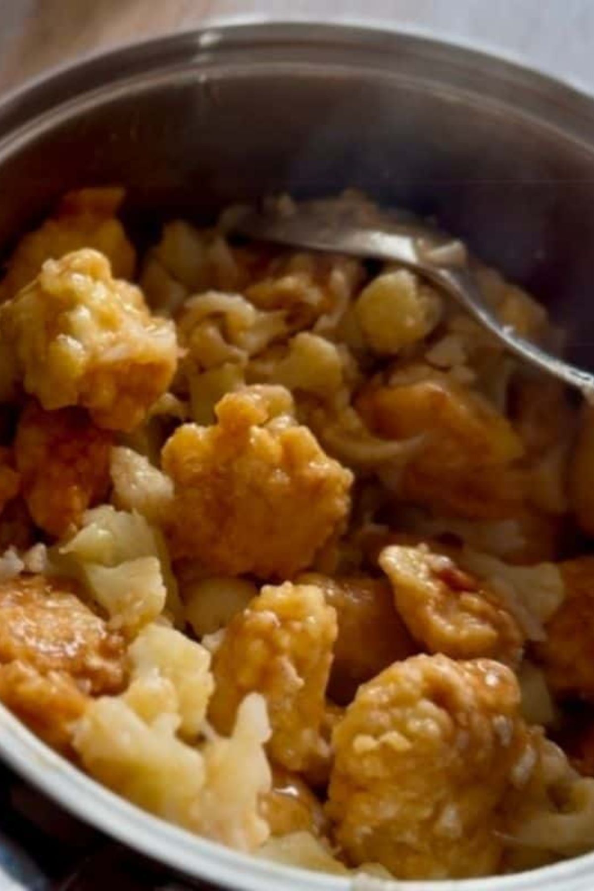 Crispy fried chicken served on a plate with rice.
