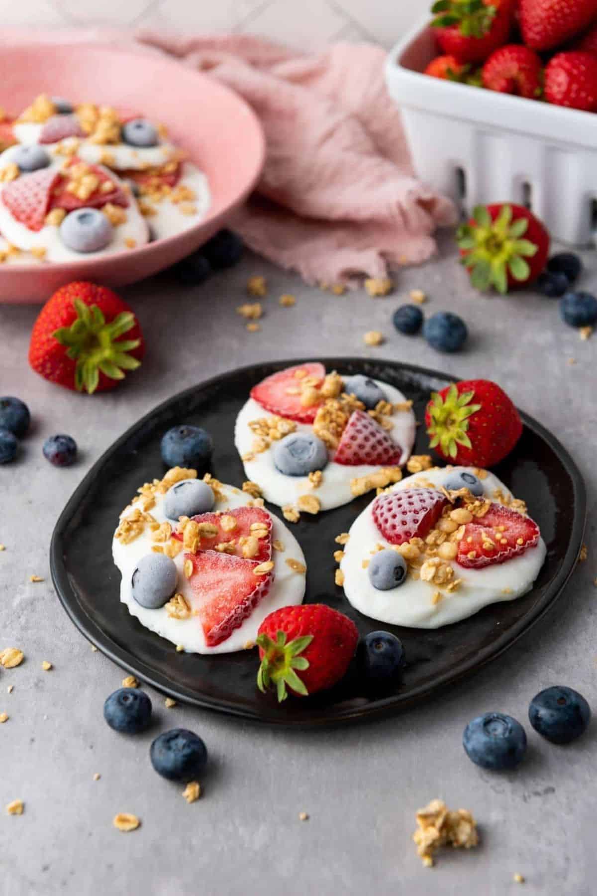 Delicious yogurt parfaits topped with strawberries, blueberries, and granola, perfect for a healthy breakfast or snack.