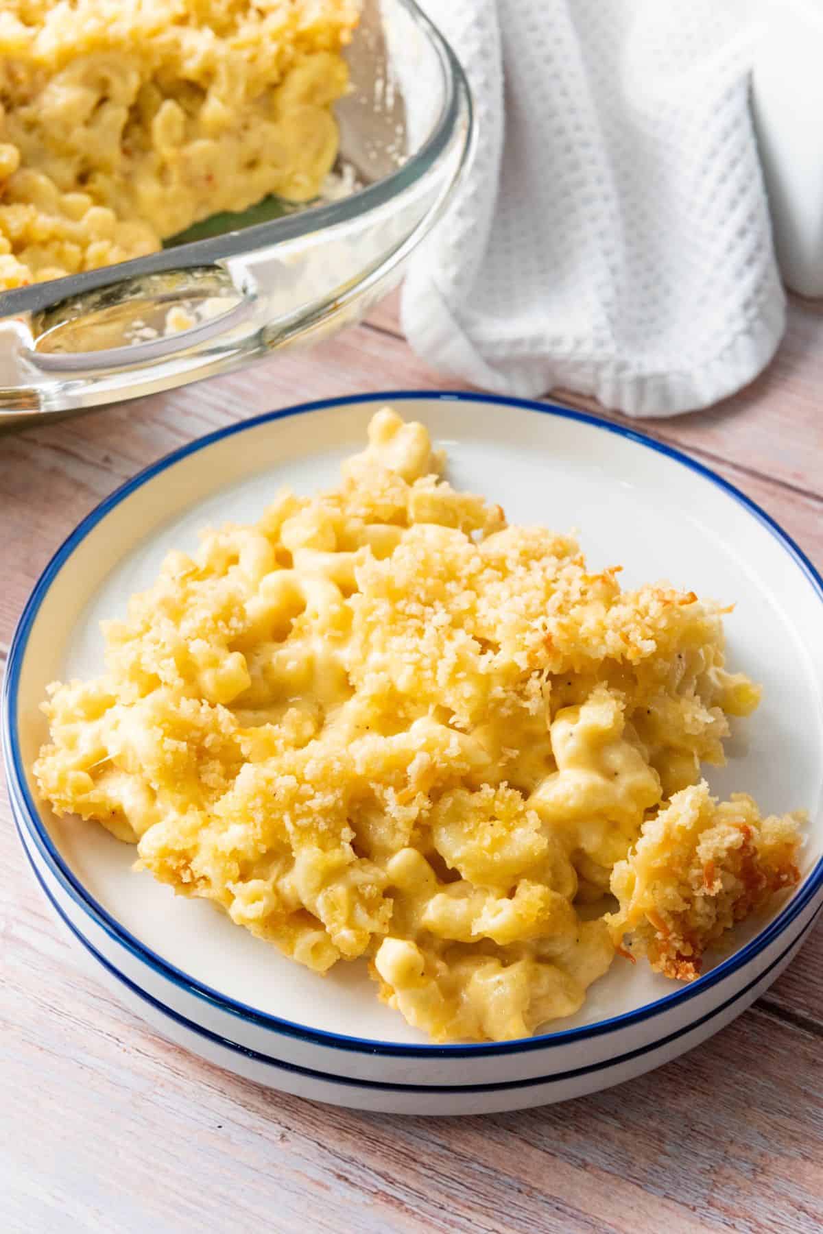 A plate with baked macaroni and cheese, showing the creamy cheesy texture.