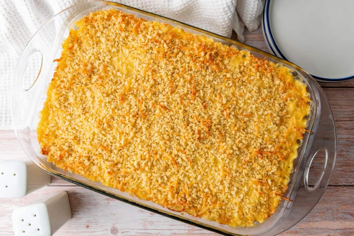 A delicious, homemade cheesy baked casserole in a glass dish with crispy topping, perfect for family dinners.