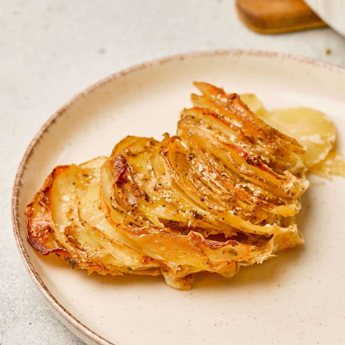 Delicious layered potato gratin with crispy cheese topping and creamy interior. Perfectly baked, flavorful comfort food.