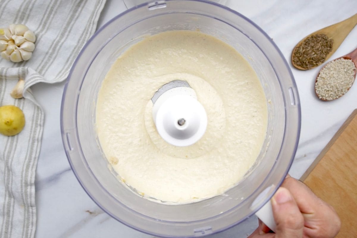 Food processor with smooth batter for cooking or baking ingredients.