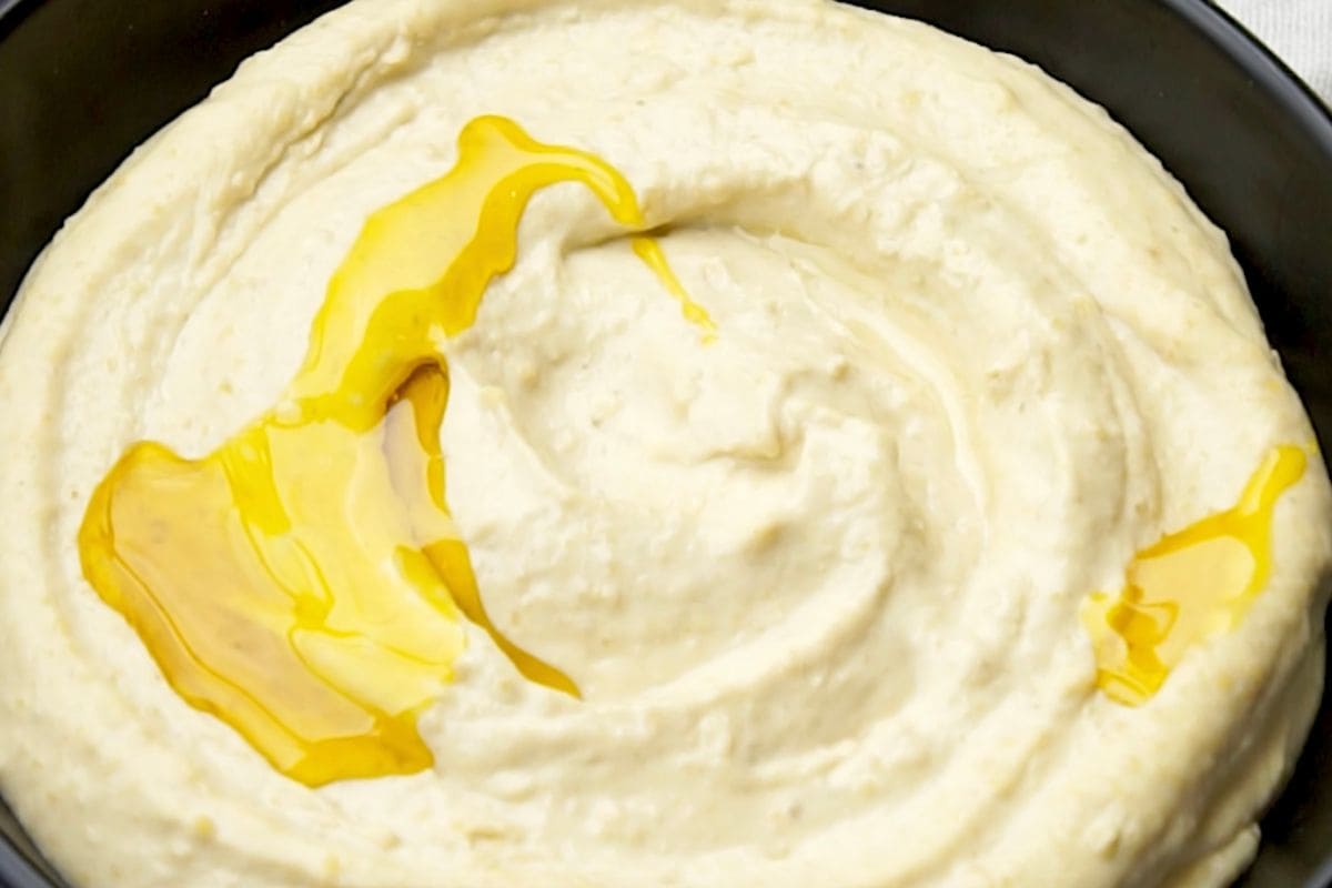 Silky mashed potatoes topped with a drizzle of melted butter for comfort food. Perfect side dish for any meal.