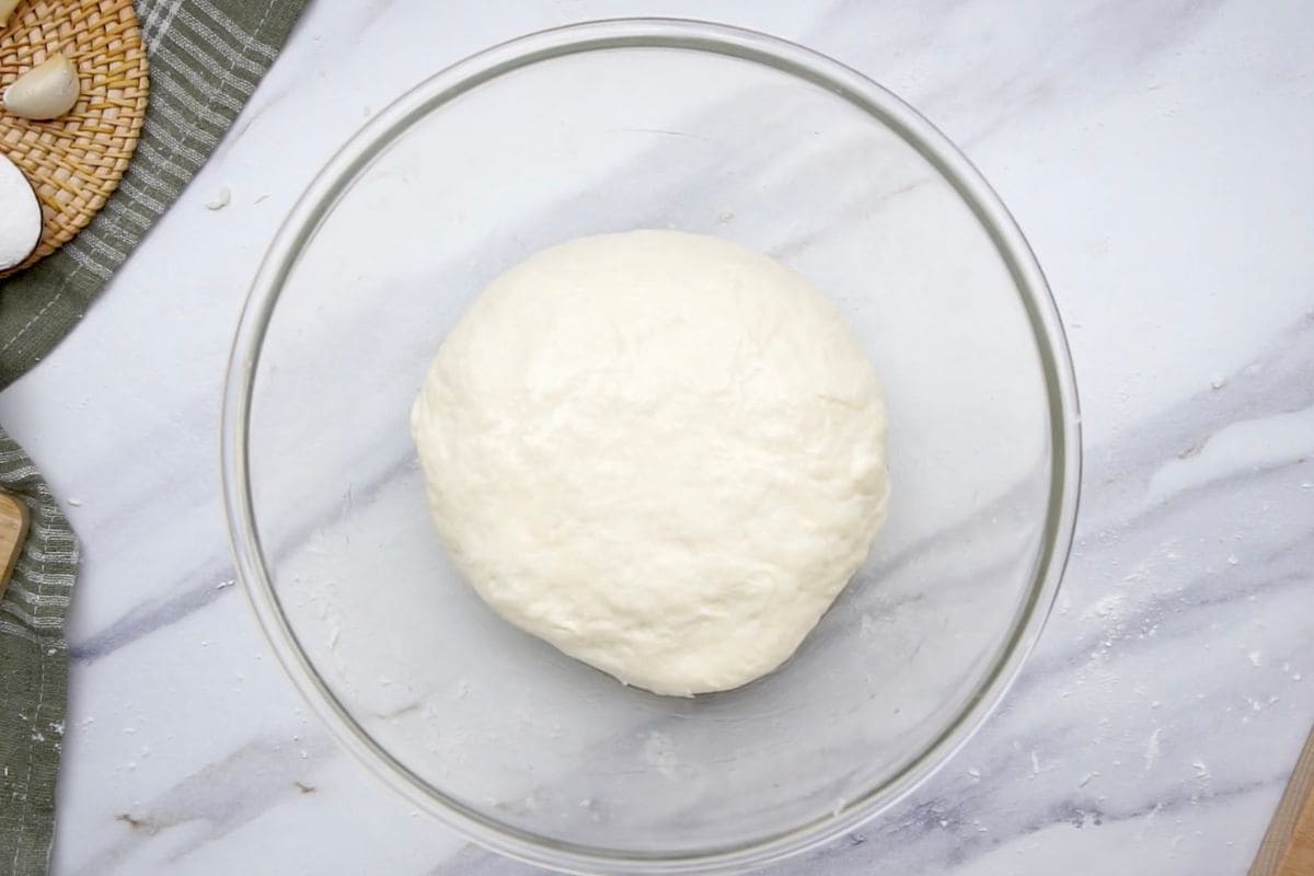 Soft dough ball ready for baking or pizza making.