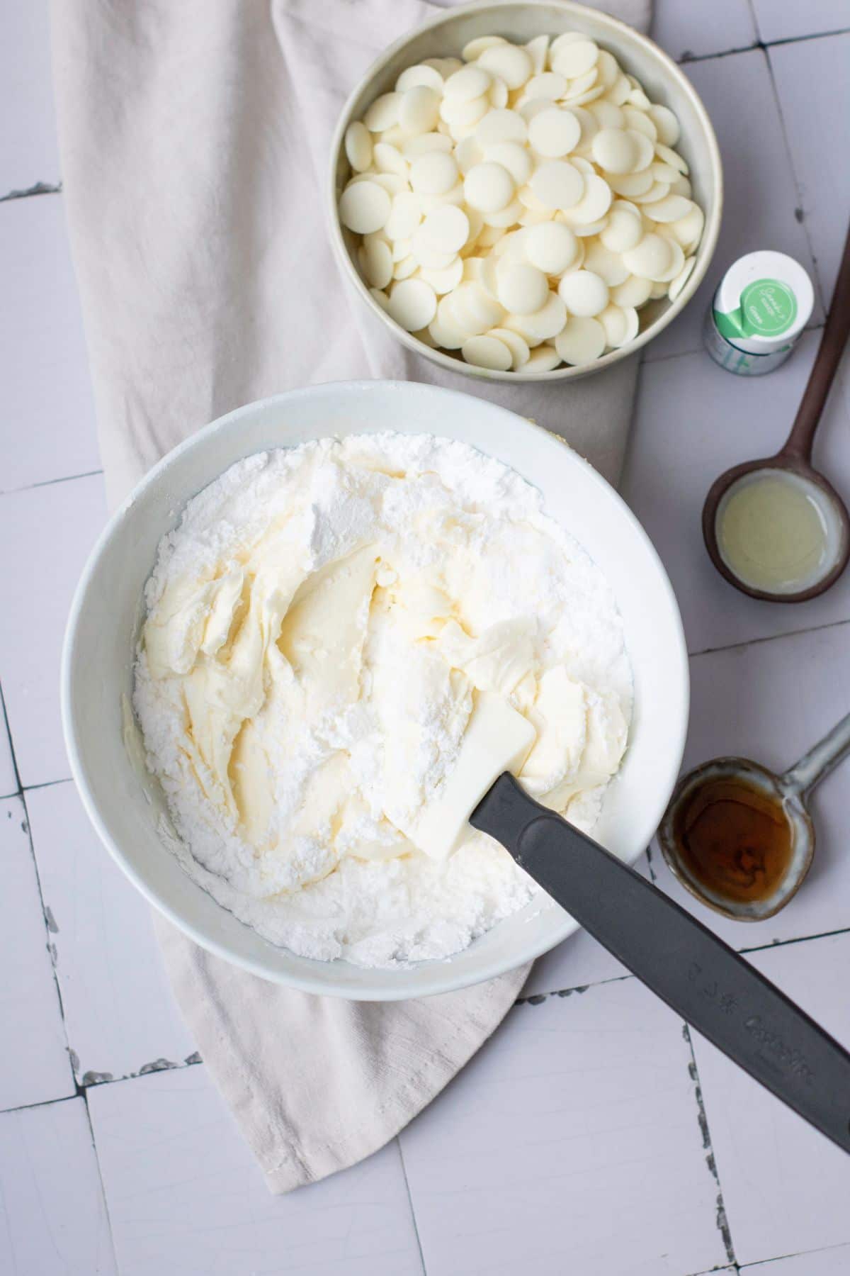 Fresh white chocolate chips, butter, and baking supplies ready to make delicious cookies.