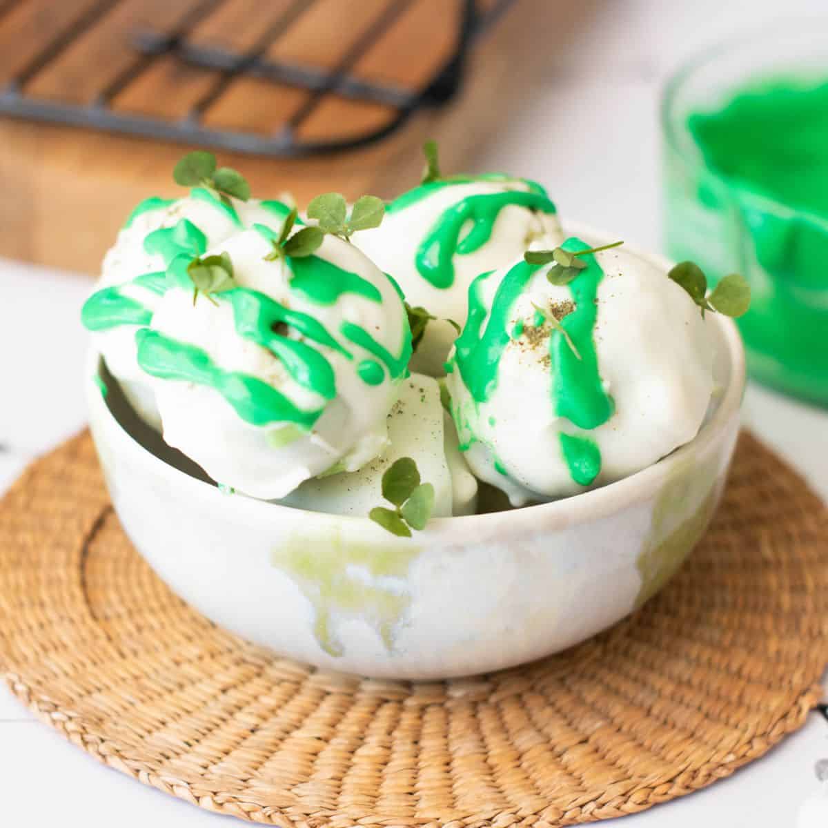 Delicious green and white dessert with sprigs of tiny leaves, perfect for St. Patrick's Day celebrations.