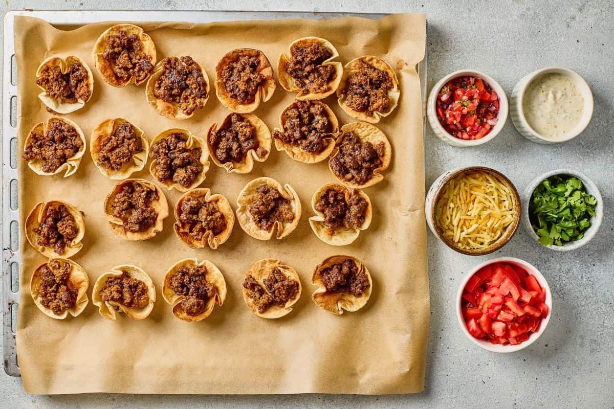 Delicious homemade mini taco cups with seasoned beef and fresh toppings.